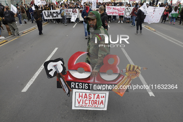 Members of the Comite 68 and various organizations march from the Plaza de las Tres Culturas in Tlatelolco to the Zocalo in Mexico City, Mex...