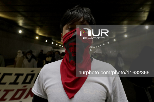 Members of the Comite 68 and various organizations march from the Plaza de las Tres Culturas in Tlatelolco to the Zocalo in Mexico City, Mex...