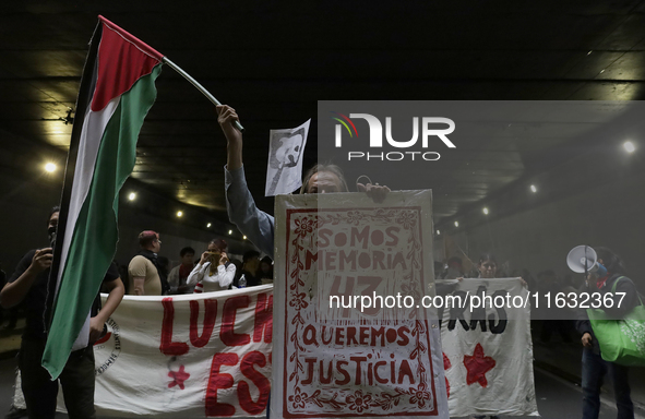 Members of the Comite 68 and various organizations march from the Plaza de las Tres Culturas in Tlatelolco to the Zocalo in Mexico City, Mex...