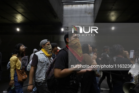 Members of the Comite 68 and various organizations march from the Plaza de las Tres Culturas in Tlatelolco to the Zocalo in Mexico City, Mex...