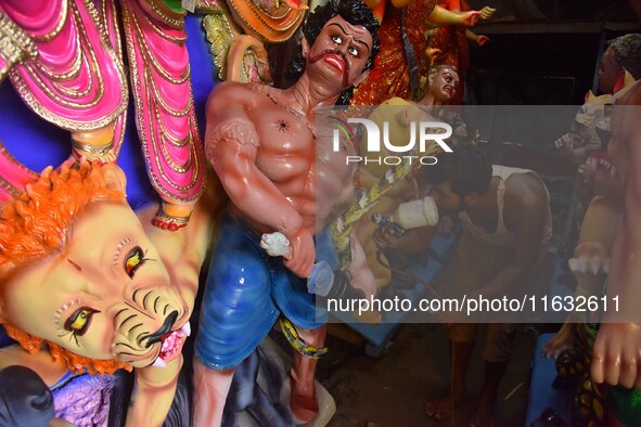 Artisans prepare idols ahead of the Durga Puja festival in Nagaon District of Assam, India, on October 3, 2024. 