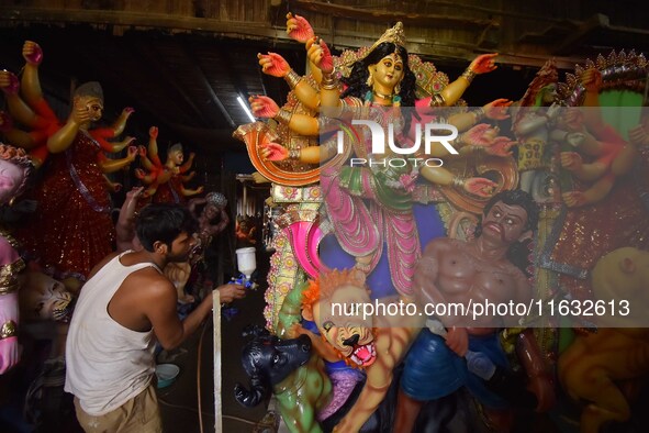 Artisans prepare idols of the Hindu goddess Durga ahead of the Durga Puja festival in Nagaon District, Assam, India, on October 3, 2024. 