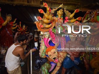 Artisans prepare idols of the Hindu goddess Durga ahead of the Durga Puja festival in Nagaon District, Assam, India, on October 3, 2024. (