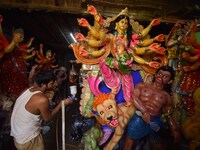 Artisans prepare idols of the Hindu goddess Durga ahead of the Durga Puja festival in Nagaon District, Assam, India, on October 3, 2024. (