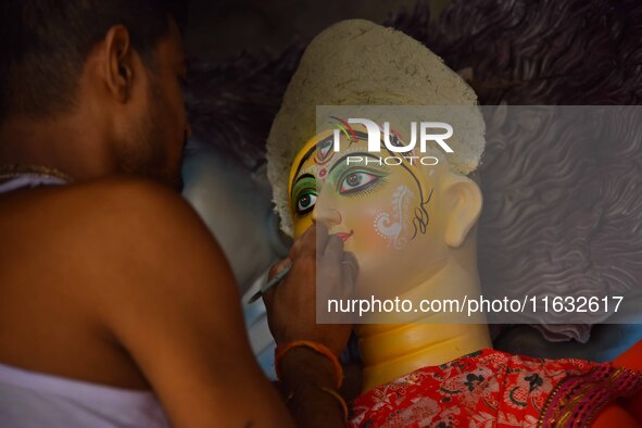 Artisans prepare idols of the Hindu goddess Durga ahead of the Durga Puja festival in Nagaon District, Assam, India, on October 3, 2024. 