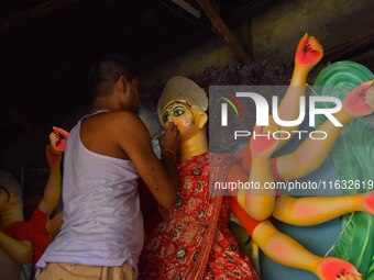 Artisans prepare idols of the Hindu goddess Durga ahead of the Durga Puja festival in Nagaon District, Assam, India, on October 3, 2024. (