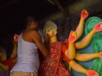 Artisans prepare idols of the Hindu goddess Durga ahead of the Durga Puja festival in Nagaon District, Assam, India, on October 3, 2024. (