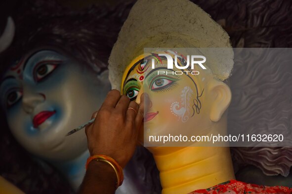 Artisans prepare idols of the Hindu goddess Durga ahead of the Durga Puja festival in Nagaon District, Assam, India, on October 3, 2024. 