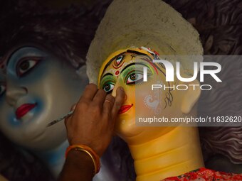 Artisans prepare idols of the Hindu goddess Durga ahead of the Durga Puja festival in Nagaon District, Assam, India, on October 3, 2024. (