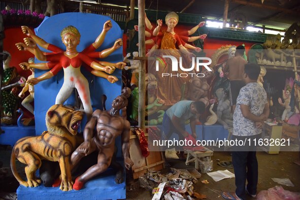 Artisans prepare idols of the Hindu goddess Durga ahead of the Durga Puja festival in Nagaon District, Assam, India, on October 3, 2024. 