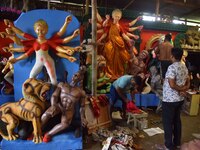 Artisans prepare idols of the Hindu goddess Durga ahead of the Durga Puja festival in Nagaon District, Assam, India, on October 3, 2024. (