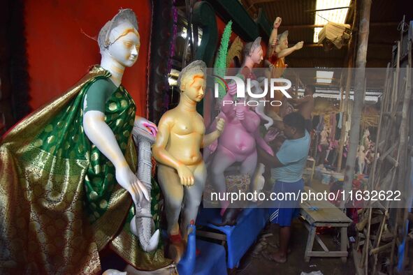 Artisans prepare idols of the Hindu goddess Durga ahead of the Durga Puja festival in Nagaon District, Assam, India, on October 3, 2024. 