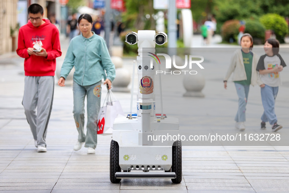 A 5G ''robot police'' patrols a business district in Zhoushan, China, on October 3, 2024. 