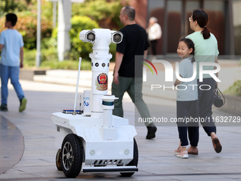 A 5G ''robot police'' patrols a business district in Zhoushan, China, on October 3, 2024. (