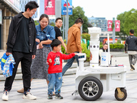 A 5G ''robot police'' patrols a business district in Zhoushan, China, on October 3, 2024. (