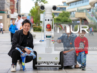 A 5G ''robot police'' patrols a business district in Zhoushan, China, on October 3, 2024. (