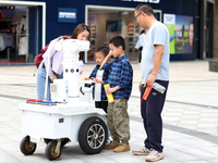 A 5G ''robot police'' patrols a business district in Zhoushan, China, on October 3, 2024. (