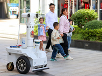 A 5G ''robot police'' patrols a business district in Zhoushan, China, on October 3, 2024. (