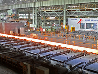 Workers perform a routine inspection at a hot rolling workshop of Lubao Steel Pipe Co., LTD in the Fushan district of Yantai, China, on Octo...