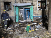 A firefighter stands outside the residential building damaged by a Russian guided missile strike in Kharkiv, Ukraine, on September 3, 2024....