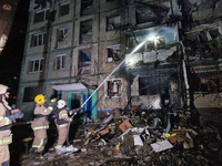 Firefighters put out a fire in a residential building damaged by a Russian guided missile strike in Kharkiv, Ukraine, on September 3, 2024....