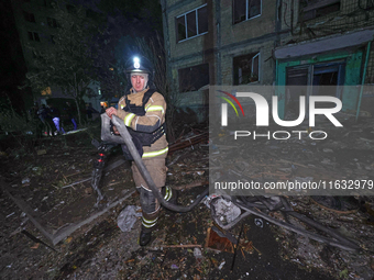 A rescuer is seen outside the residential building damaged by a Russian guided missile strike in Kharkiv, Ukraine, on September 3, 2024. (