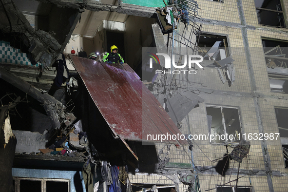 A rescuer is seen in the residential building damaged by a Russian guided missile strike in Kharkiv, Ukraine, on September 3, 2024. NO USE R...