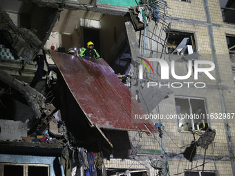 A rescuer is seen in the residential building damaged by a Russian guided missile strike in Kharkiv, Ukraine, on September 3, 2024. NO USE R...