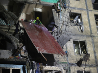 A rescuer is seen in the residential building damaged by a Russian guided missile strike in Kharkiv, Ukraine, on September 3, 2024. NO USE R...