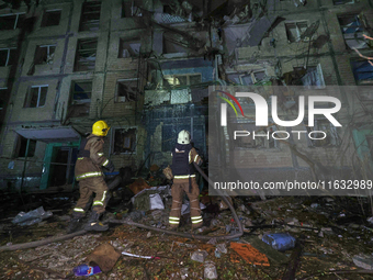 Firefighters put out a fire in a residential building damaged by a Russian guided missile strike in Kharkiv, Ukraine, on September 3, 2024....