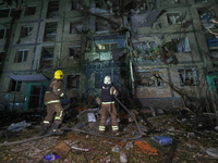 Firefighters put out a fire in a residential building damaged by a Russian guided missile strike in Kharkiv, Ukraine, on September 3, 2024....