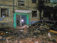 A rescuer walks out of the residential building damaged by a Russian guided missile strike in Kharkiv, Ukraine, on September 3, 2024. (