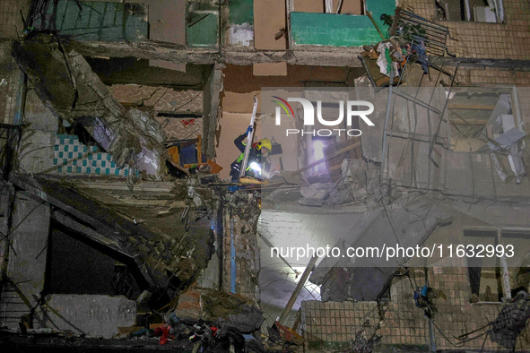 A rescuer is seen in the residential building damaged by a Russian guided missile strike in Kharkiv, Ukraine, on September 3, 2024. NO USE R...