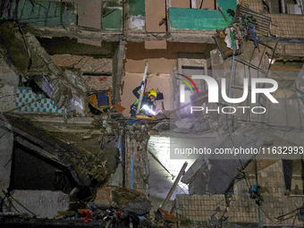 A rescuer is seen in the residential building damaged by a Russian guided missile strike in Kharkiv, Ukraine, on September 3, 2024. NO USE R...