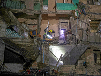 A rescuer is seen in the residential building damaged by a Russian guided missile strike in Kharkiv, Ukraine, on September 3, 2024. NO USE R...