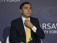 The former foreign minister of North Macedonia and President of the Balkan Center for Constructive Policies adjusts his tie during the Warsa...