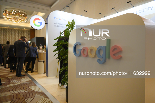 People stand by a Google stand during the Warsaw Security Forum 2024 in Warsaw, Poland on October 2, 2024. WSF2024, entitled 'Ensuring Secur...