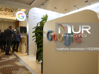 People stand by a Google stand during the Warsaw Security Forum 2024 in Warsaw, Poland on October 2, 2024. WSF2024, entitled 'Ensuring Secur...