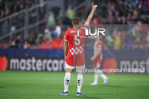 David Lopez of Girona FC participates in the UEFA Champions League 2024/25 League Phase MD2 match between Girona FC and Feyenoord at Estadi...