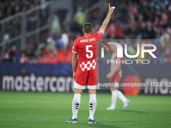 David Lopez of Girona FC participates in the UEFA Champions League 2024/25 League Phase MD2 match between Girona FC and Feyenoord at Estadi...