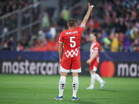 David Lopez of Girona FC participates in the UEFA Champions League 2024/25 League Phase MD2 match between Girona FC and Feyenoord at Estadi...