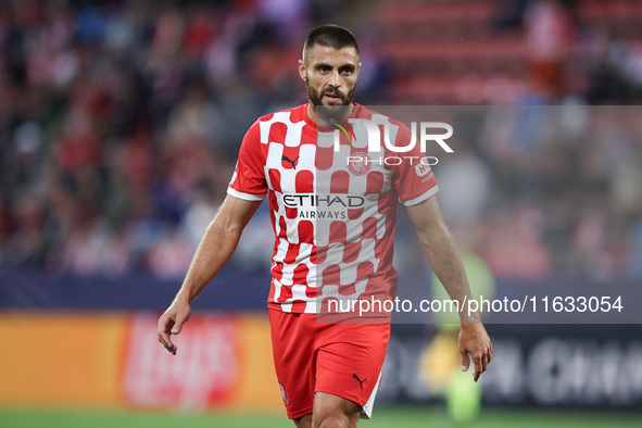 David Lopez of Girona FC participates in the UEFA Champions League 2024/25 League Phase MD2 match between Girona FC and Feyenoord at Estadi...