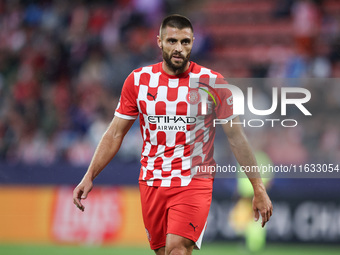 David Lopez of Girona FC participates in the UEFA Champions League 2024/25 League Phase MD2 match between Girona FC and Feyenoord at Estadi...