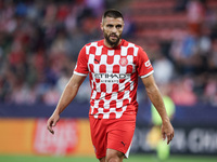 David Lopez of Girona FC participates in the UEFA Champions League 2024/25 League Phase MD2 match between Girona FC and Feyenoord at Estadi...