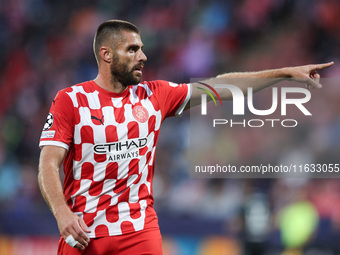 David Lopez of Girona FC participates in the UEFA Champions League 2024/25 League Phase MD2 match between Girona FC and Feyenoord at Estadi...