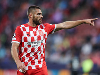 David Lopez of Girona FC participates in the UEFA Champions League 2024/25 League Phase MD2 match between Girona FC and Feyenoord at Estadi...