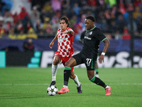 Antoni Milambo of Feyenoord fights for the ball against Bryan Gil of Girona FC during the UEFA Champions League 2024/25 League Phase MD2 mat...