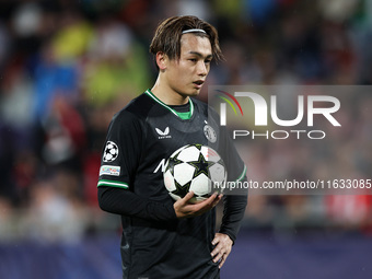 Ayase Ueda of Feyenoord has the ball during the UEFA Champions League 2024/25 League Phase MD2 match between Girona FC and Feyenoord at Esta...