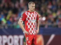 Van de Beek of Girona FC plays during the UEFA Champions League 2024/25 League Phase MD2 match between Girona FC and Feyenoord at Estadi Mon...