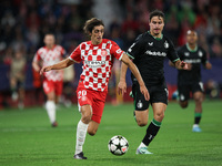 Bryan Gil of Girona FC controls the ball during the UEFA Champions League 2024/25 League Phase MD2 match between Girona FC and Feyenoord at...